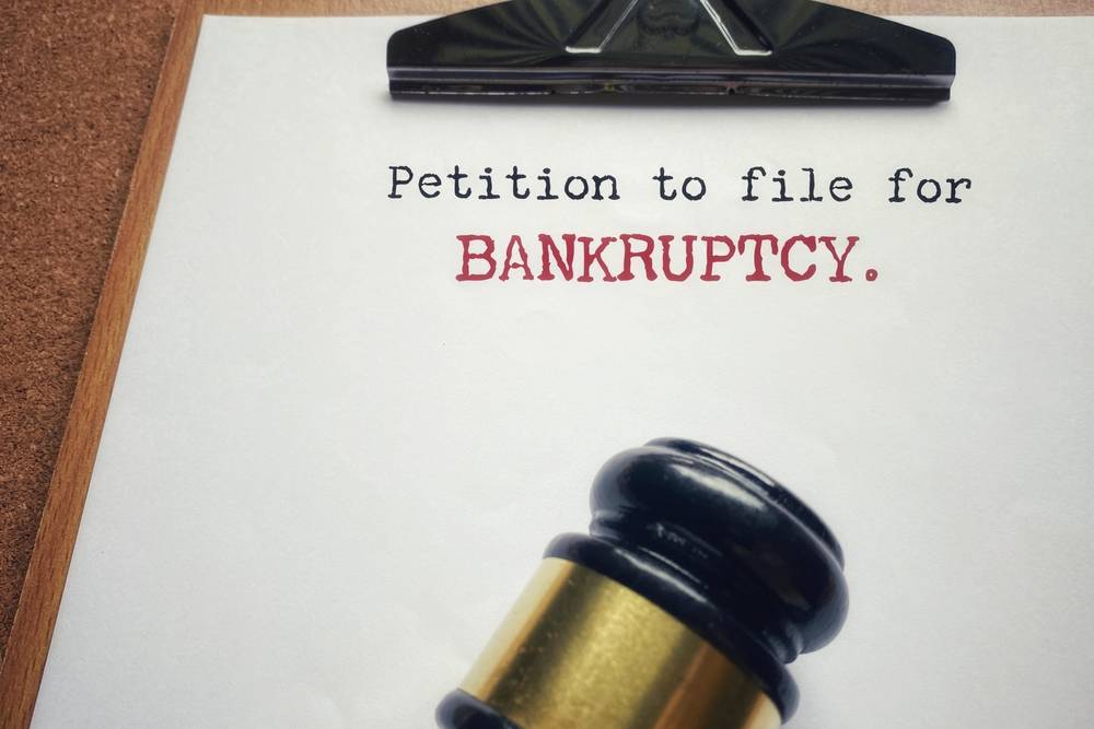 Petition to file for bankruptcy text background. Stock photo